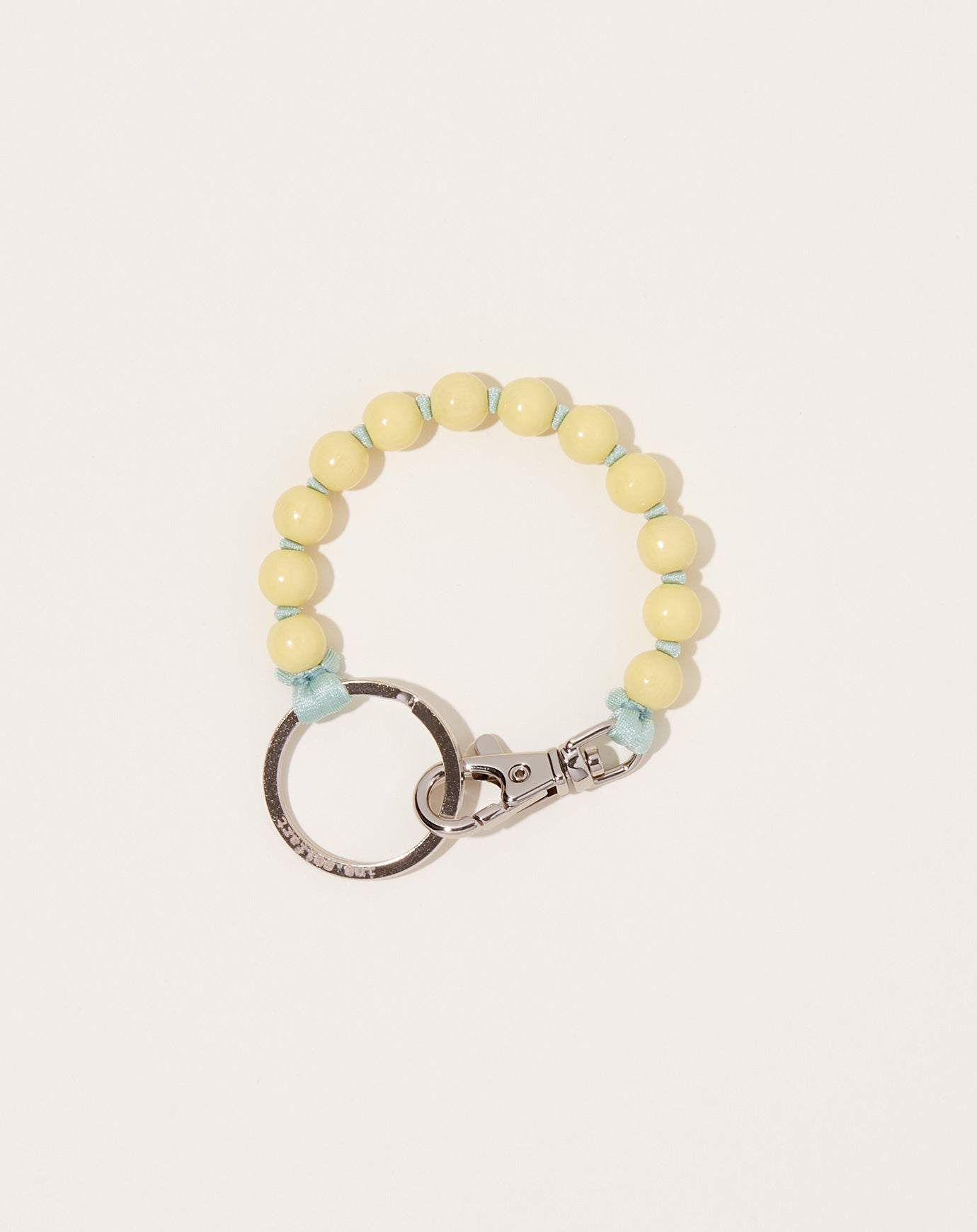 Ina Seifart Perlen Short Keyholder in Pastel Yellow on Salvia