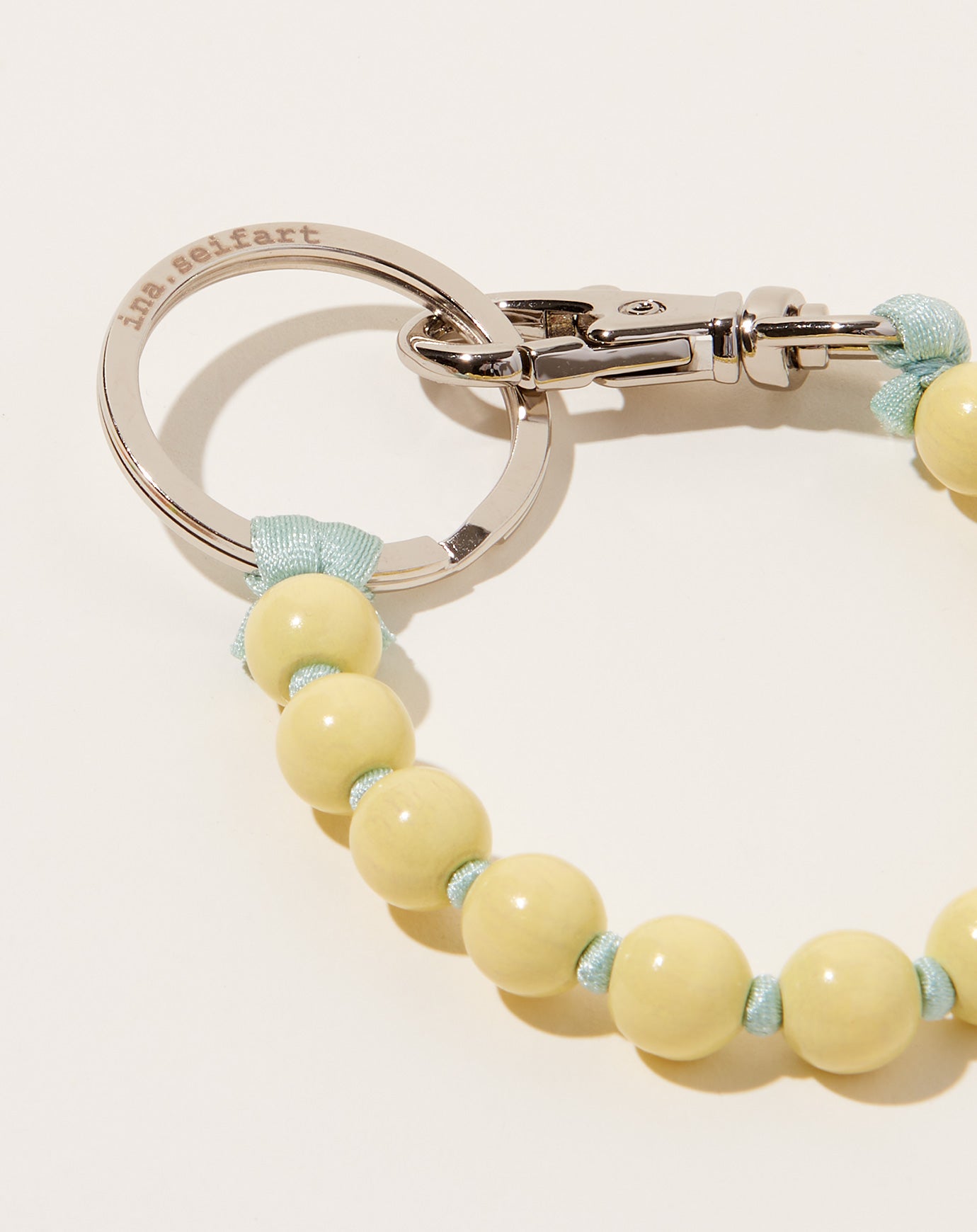 Ina Seifart Perlen Short Keyholder in Pastel Yellow on Salvia