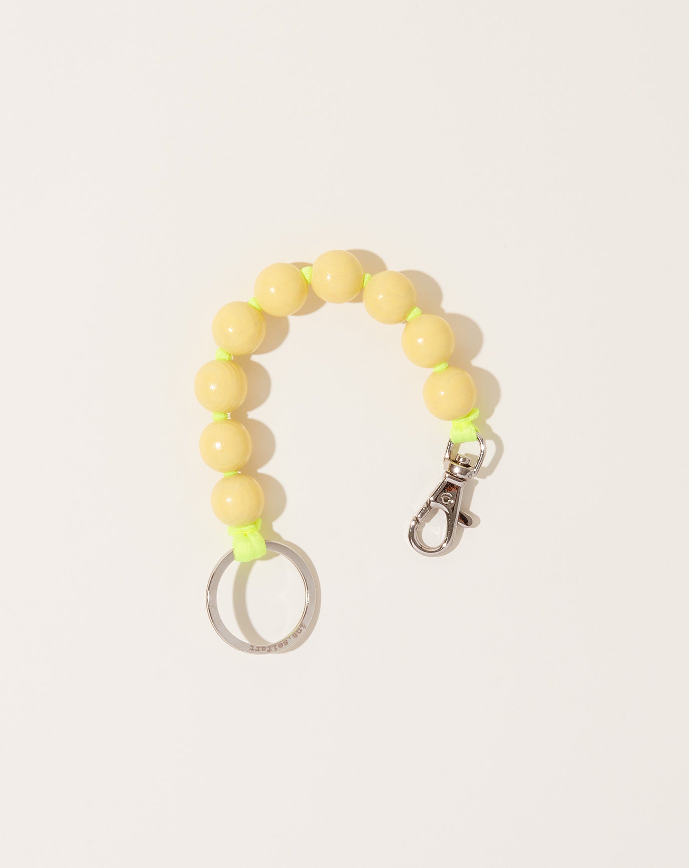 Ina Seifart Big Perlen Short Keyholder in Pastel Yellow on Neon Yellow