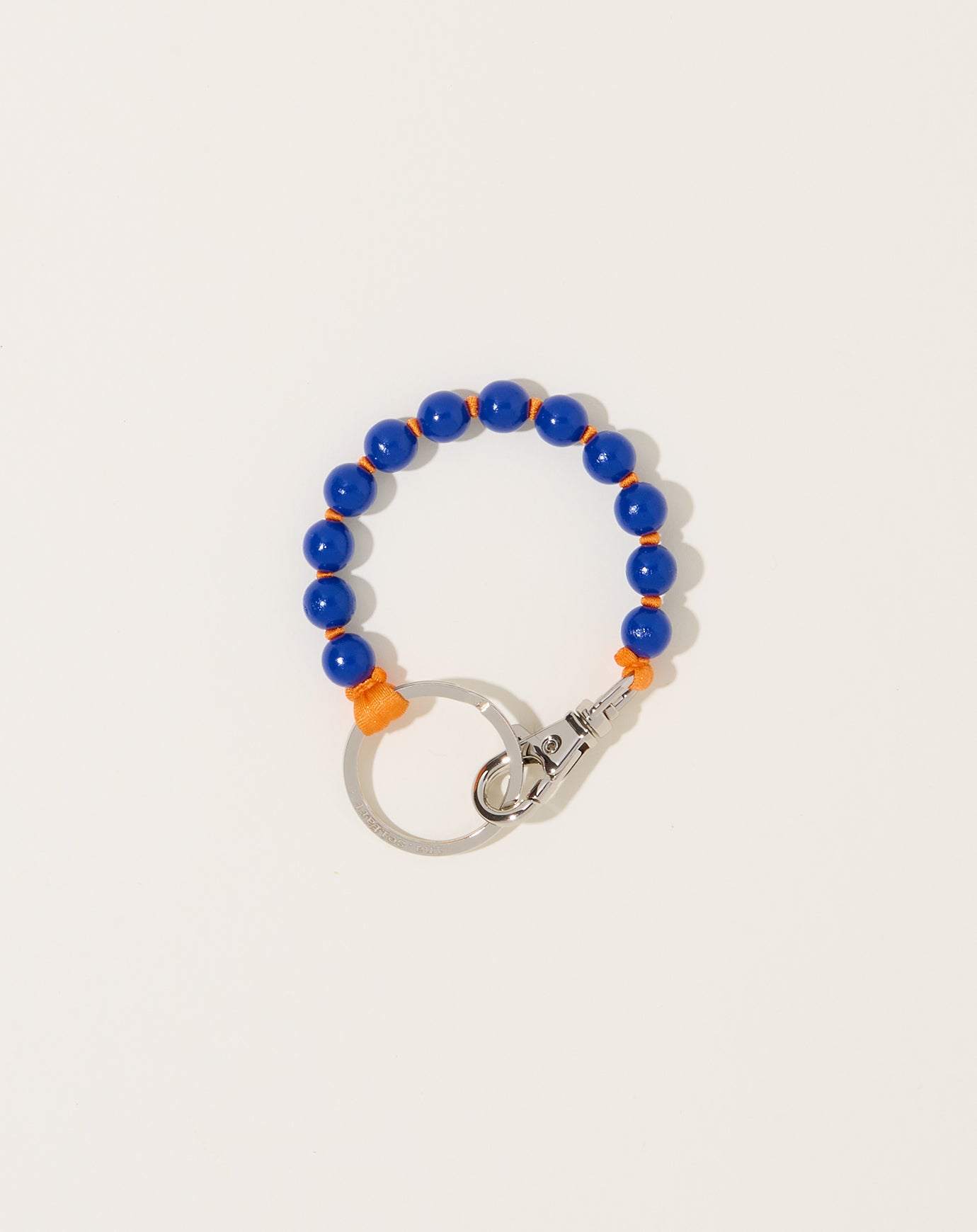 Ina Seifart Perlen Short Keyholder in Blue on Orange