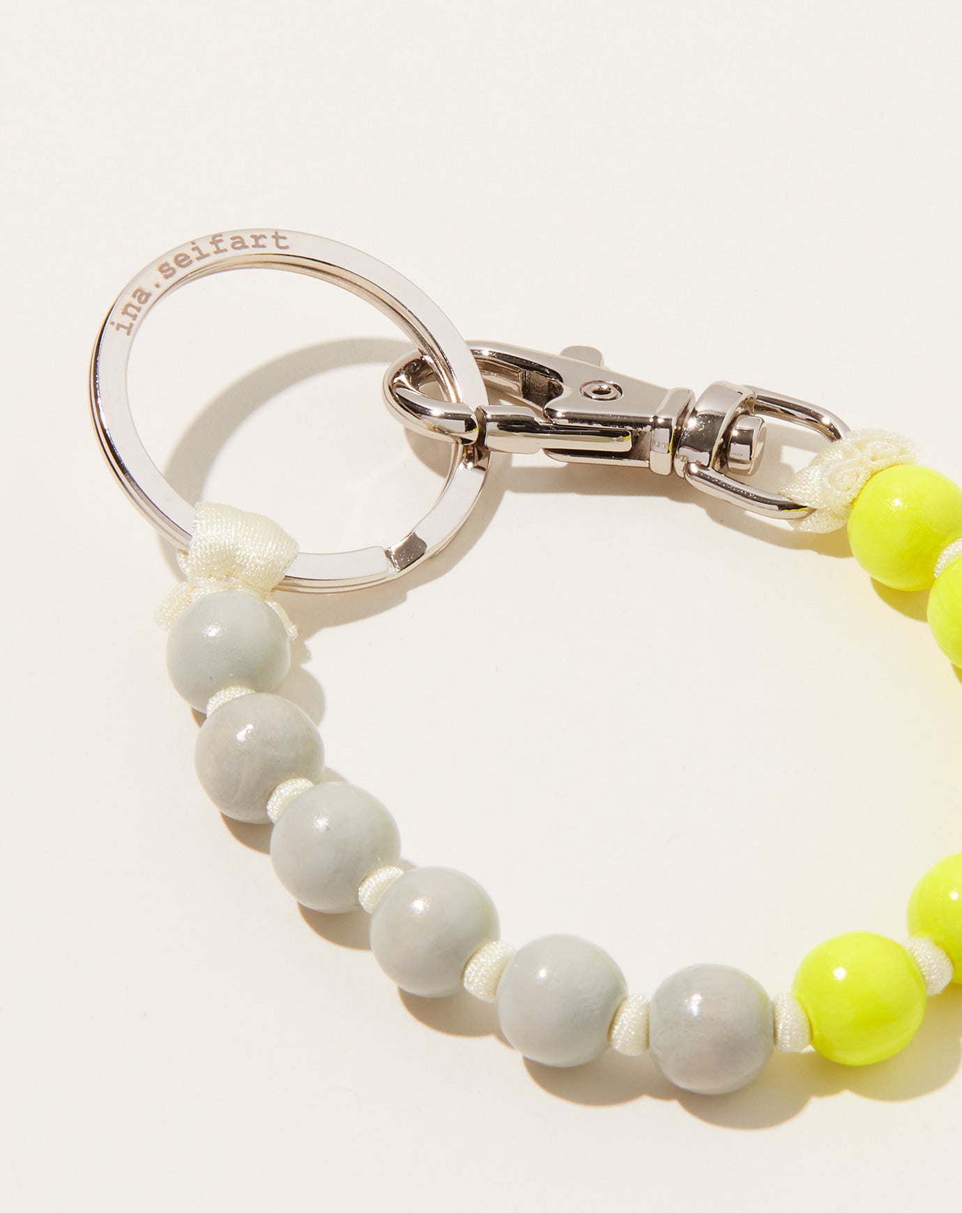 Ina Seifart Perlen Short Keyholder in Light Grey Neon Yellow and Opal