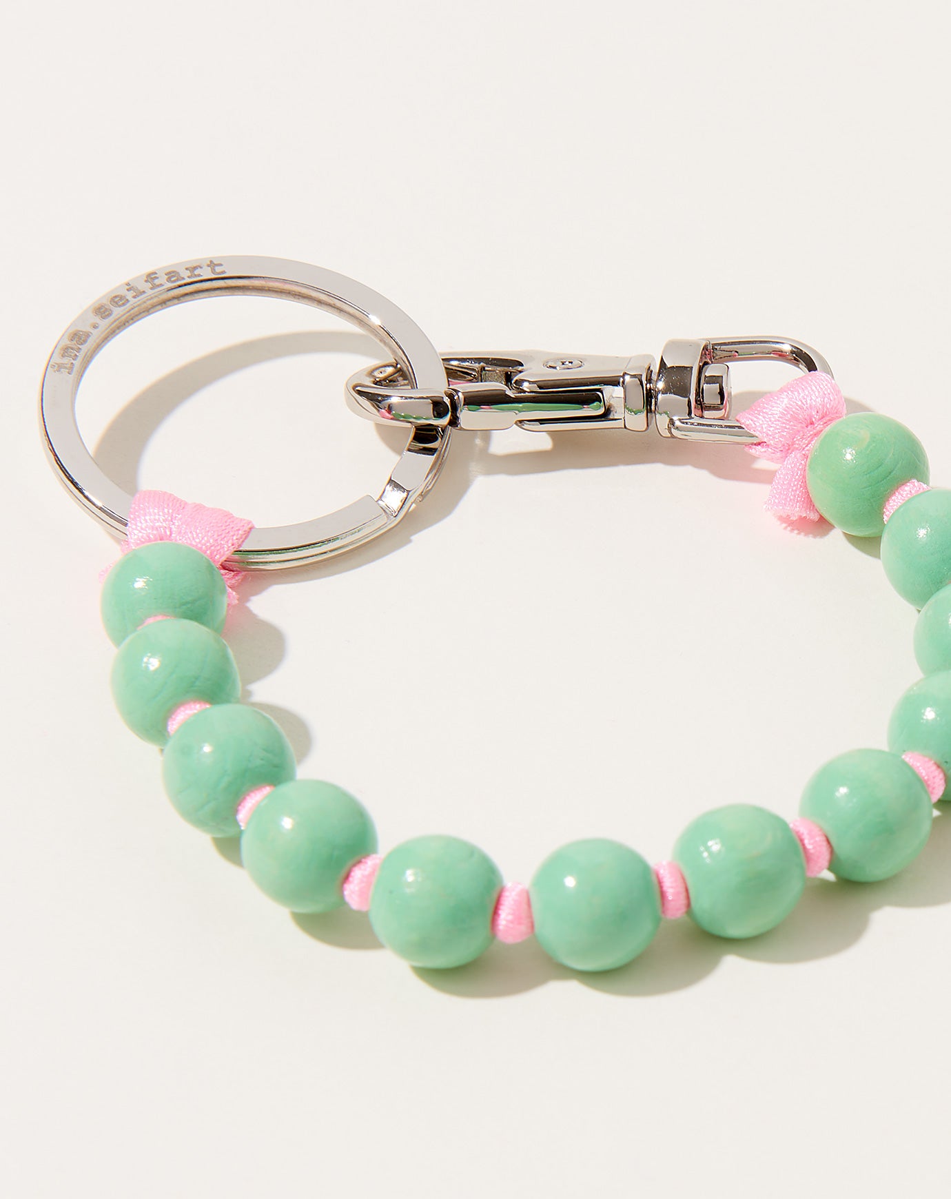 Ina Seifart Perlen Short Keyholder in Pastel Green on Rose