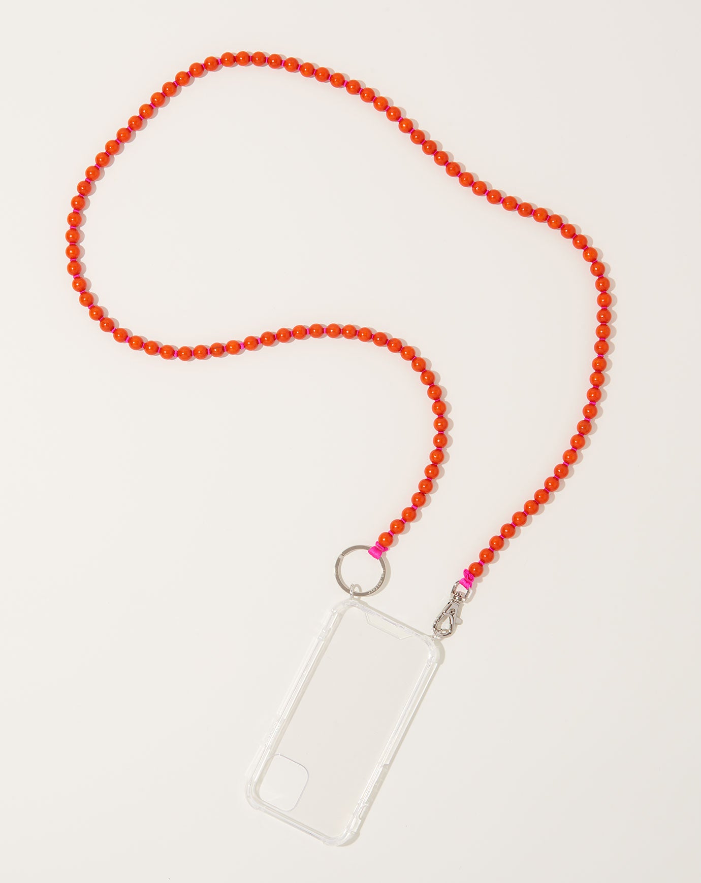 Ina Seifart Handykette iPhone Necklace in Orange on Pink