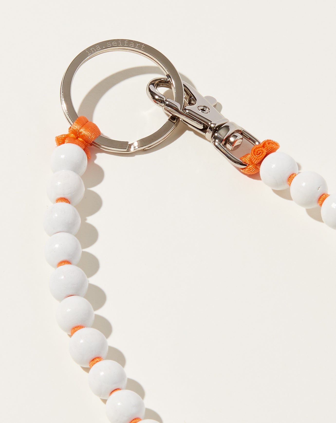 Ina Seifart Perlen Long Keyholder in White on Orange